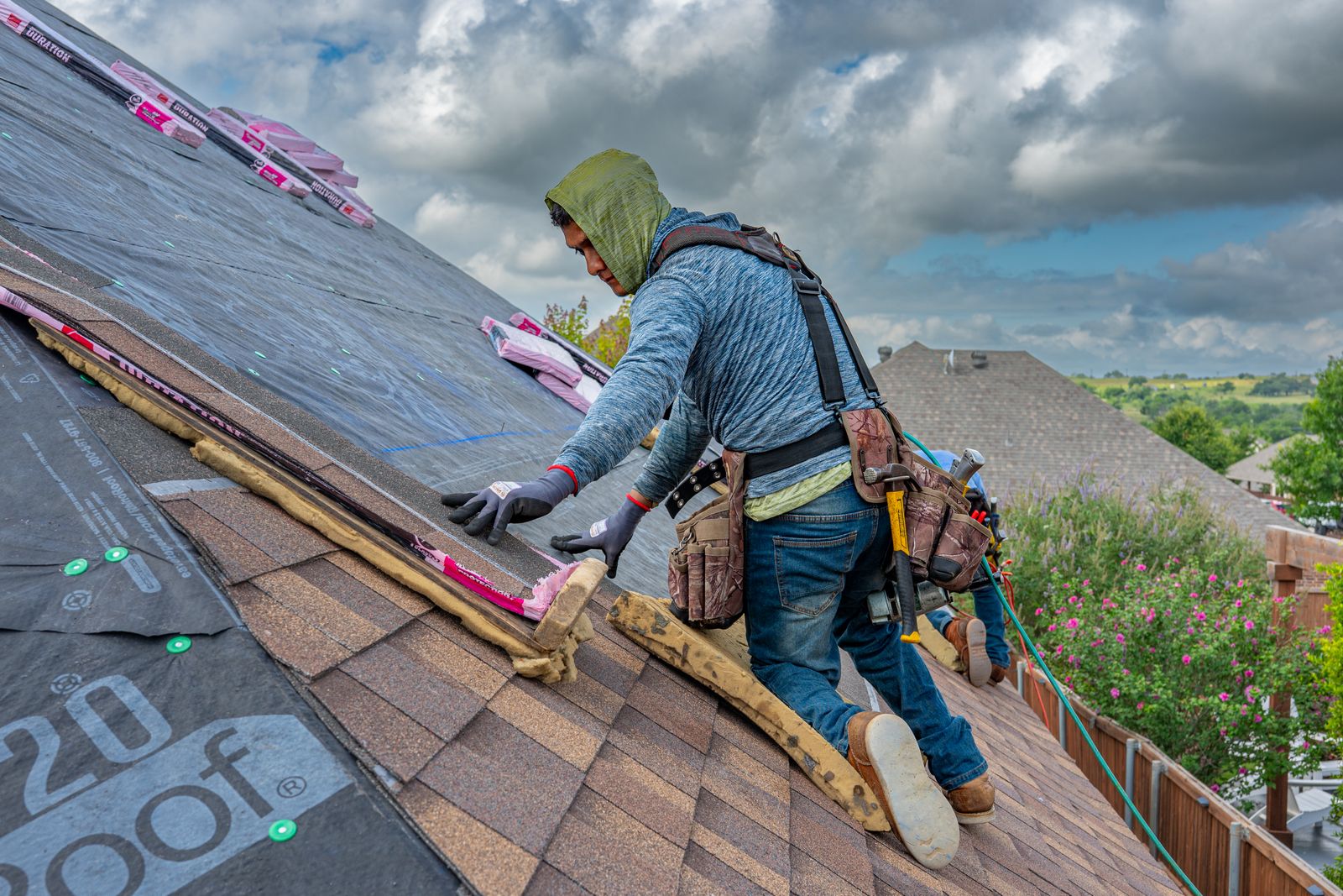 Roofing crew working on a residential roof